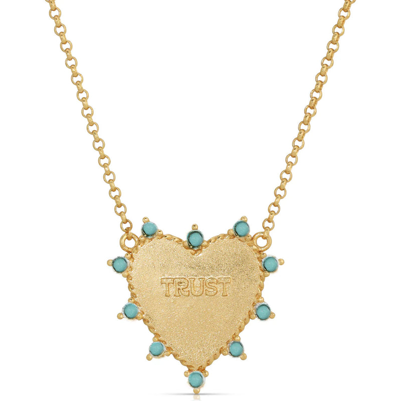 GOLD HEART NECKLACE WITH TURQUOISE AROUND IT. TRUST IS IN THE MIDDLE.