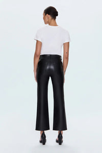 Person wearing a white t-shirt and black leather pants on a light gray background.