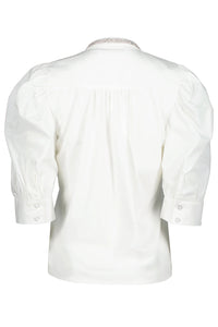 White shirt with lace collar on a white background.