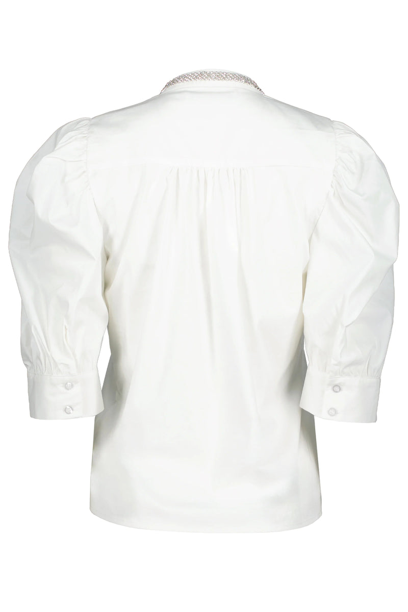 White shirt with lace collar on a white background.