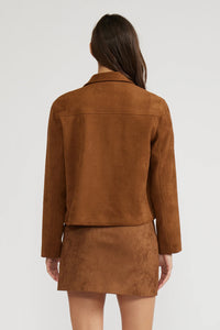 Brown suede jacket and skirt set on a white background.