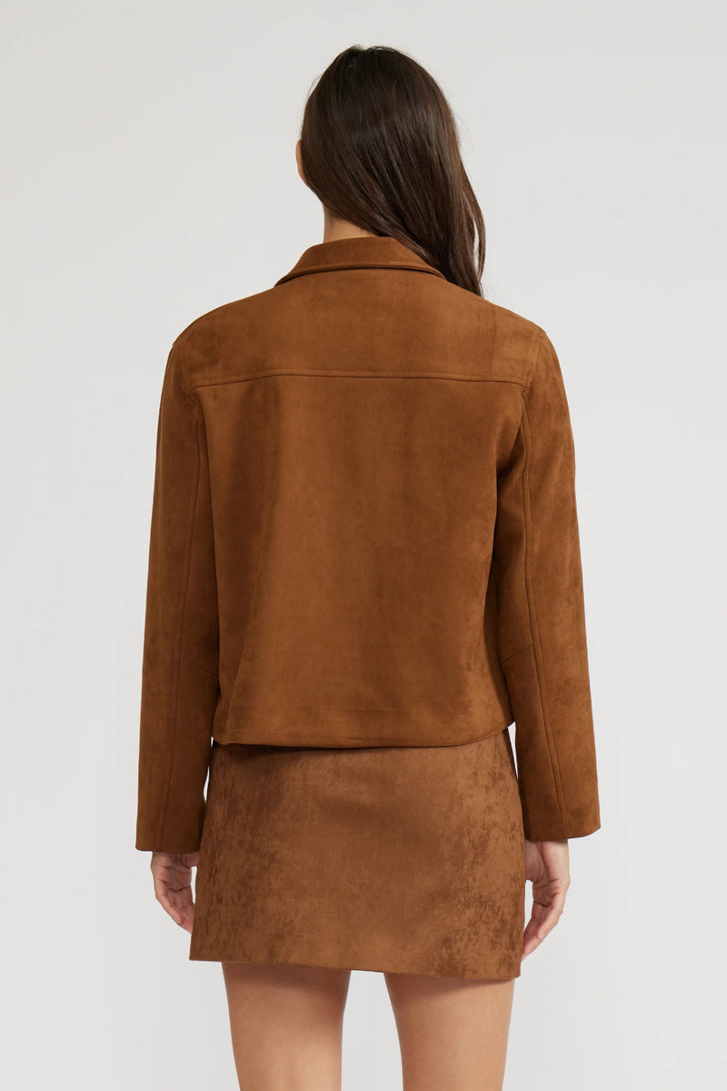 Brown suede jacket and skirt set on a white background.