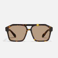Sunglasses with tortoiseshell frame and brown lenses on a white background