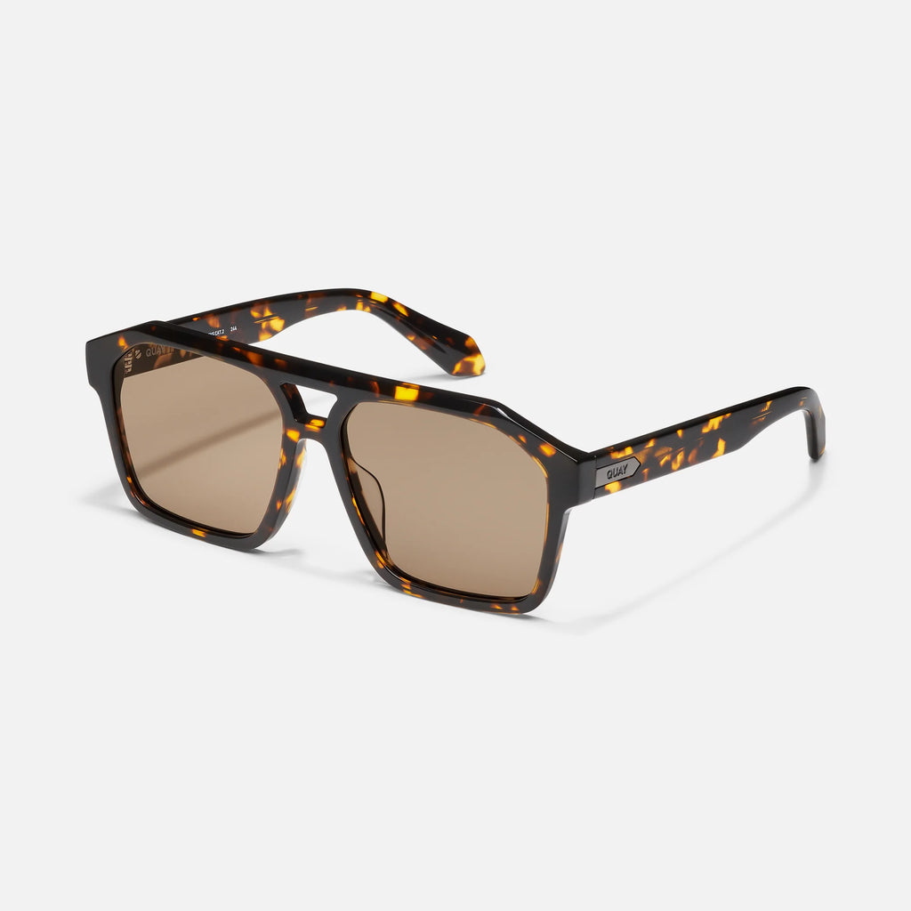 Sunglasses with tortoiseshell frame and brown lenses on a white background