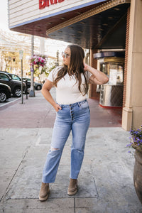 Woman wearing a white bodysuit and straight cropped jeans | Downtown Women's Boutique Billings Montana