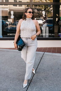 SLEEVELESS HALTER SWEATER