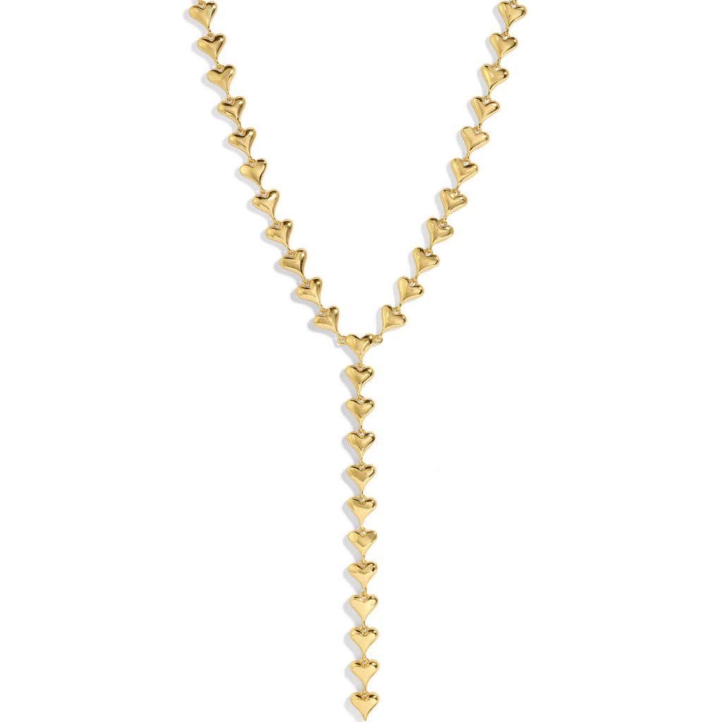 Gold heart-shaped necklace on a white background.