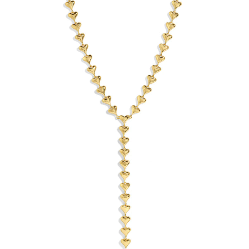 Gold heart-shaped necklace on a white background.