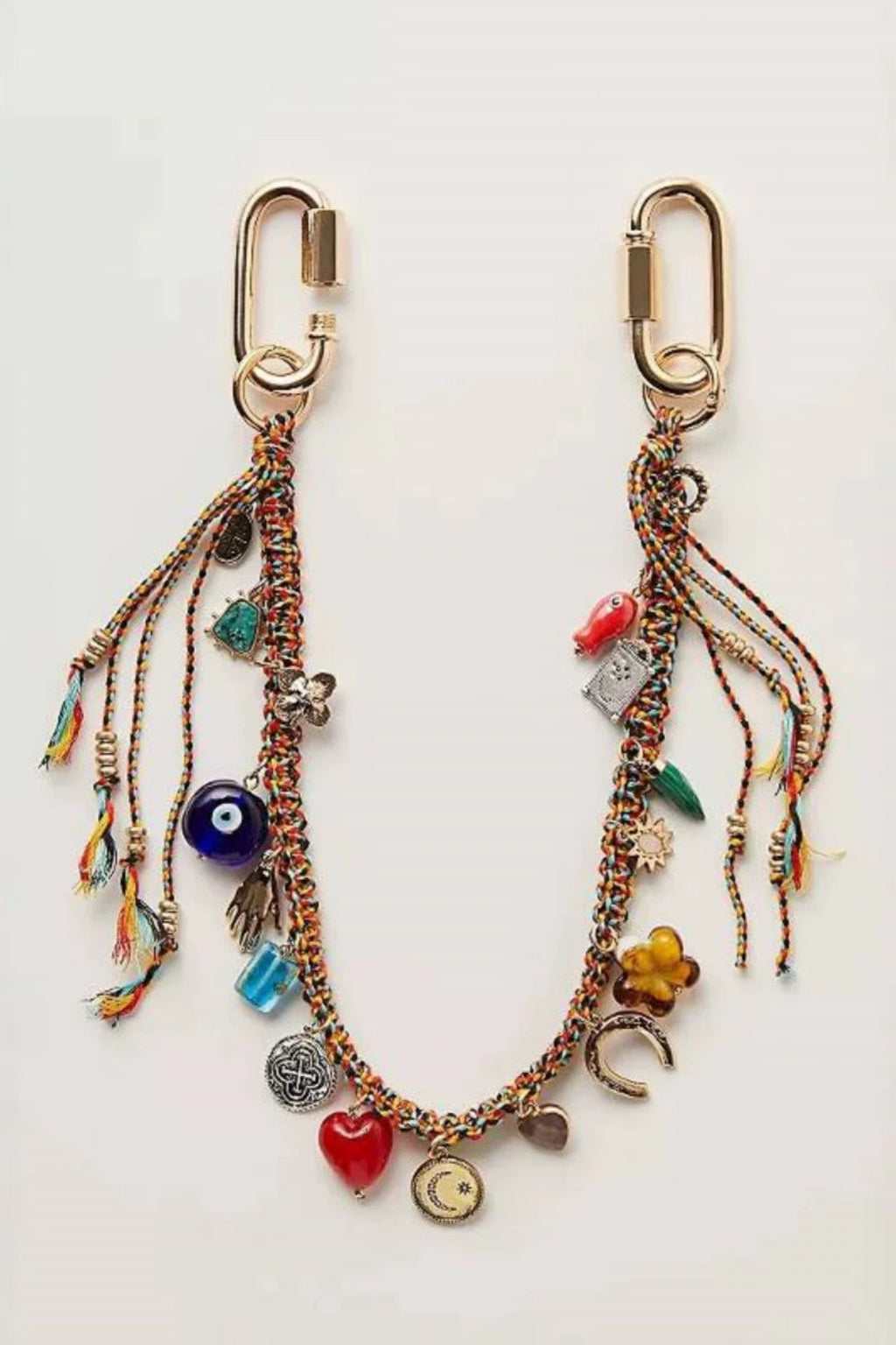 Decorative keychain with various charms on a white background.