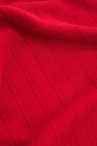 Close-up of red textured fabric.