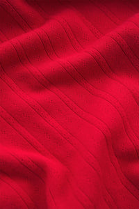 Close-up of red textured fabric.