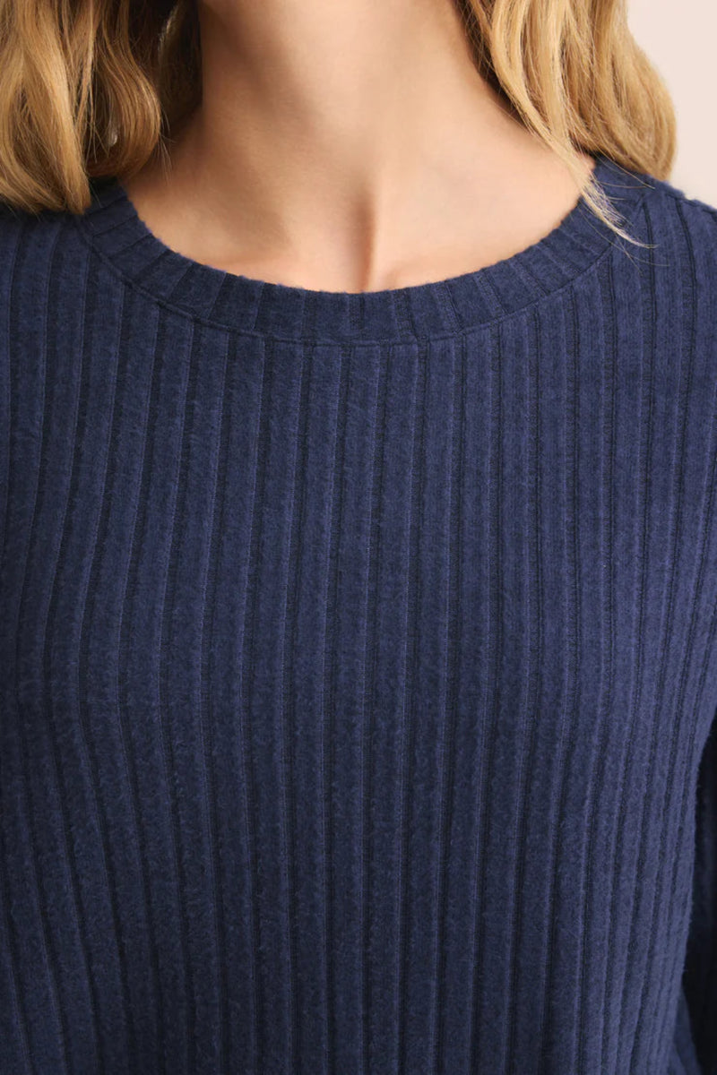 Navy blue ribbed sweater close-up.