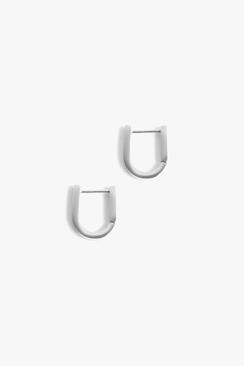 A pair of silver earrings. 