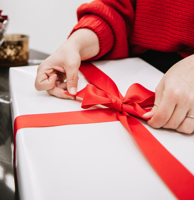 Gift Wrapping Available | Big Red Bow on a Gift | Billings Shopping